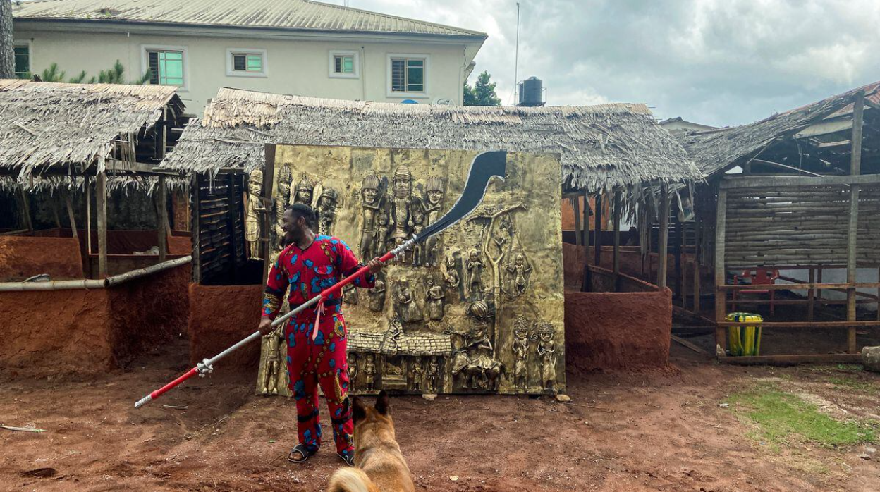Osarobo Zeickner-Okoro with his work, The return of Eware I. Author: Tife Owolabi. Source: Reuters.